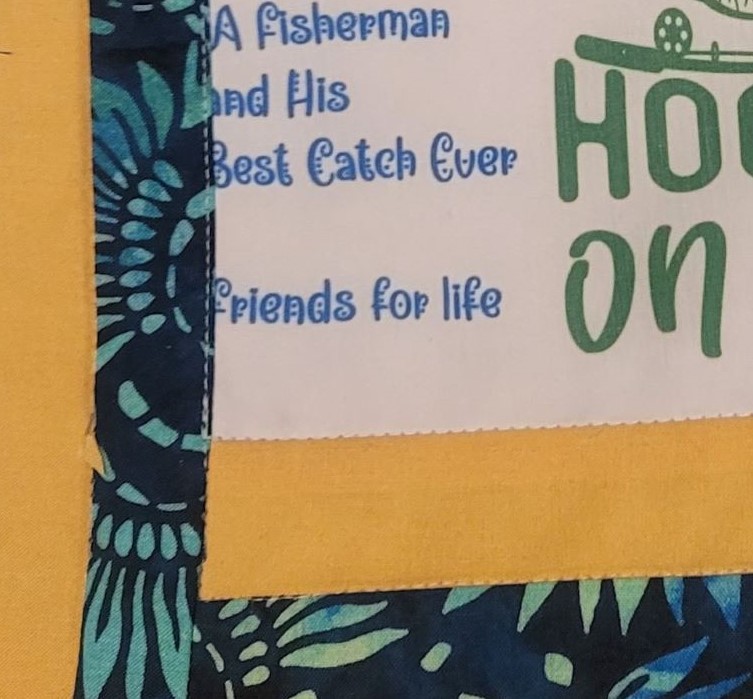 Close up photo to show stitching around label.